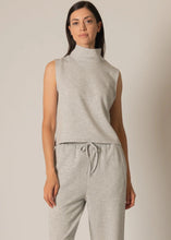 Load image into Gallery viewer, Woman wearing a gray sleeveless top and pants against a beige background