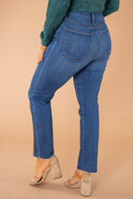 Load image into Gallery viewer, In a classic straight-leg silhouette, these high-rise jeans are perfect for showcasing your best assets. Dress them up or down for any weekday or weekend. These jeans have no distressing, a great wash, and scissor cut bottom hems. Chelsey is wearing a size 25 in the light denim Justice is wearing a size 29 n the dark denim Runs true to size 93% Cotton 5% Polyester 2% Spandex Wash Instructions Hand wash cold separately. Do not bleach. Hang to dry.