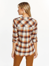 Load image into Gallery viewer, Cool and classic, this button-front top is featured in a relaxed fit with a flattering shirt tail hem and front pocket detailing. Collared neckline Front button closure Shirt tail hem Measurements for a size small: Length: 27 1/4" Chest: 20" Sleeve Length: 24.5" Fabric Content/Care: 100% Cotton Machine Wash Cold Import