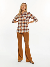Load image into Gallery viewer, Cool and classic, this button-front top is featured in a relaxed fit with a flattering shirt tail hem and front pocket detailing. Collared neckline Front button closure Shirt tail hem Measurements for a size small: Length: 27 1/4" Chest: 20" Sleeve Length: 24.5" Fabric Content/Care: 100% Cotton Machine Wash Cold Import