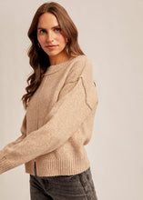 Load image into Gallery viewer, Woman wearing a beige sweater against a plain background

