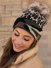 Load image into Gallery viewer, Leopard print knit hat  Camo print trim  Natural faux fur pom accent
