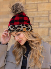Load image into Gallery viewer, Red knit buffalo plaid pom hat  Leopard print trim  Natural faux fur pom accent  Fleece lined
