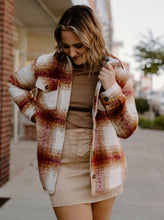 Load image into Gallery viewer, Our Thread &amp; Supply Chandler Shacket in Burgundy Rust Plaid has a full button down front with front and side pockets. Features a shaggy soft feel and relaxed fit. A perfect cozy layering piece. 100% Polyester
