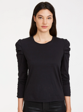 Load image into Gallery viewer, Update your closet with this elevated essential. Ruched details create gentle pleats on the side shoulders of a fitted top. Crafted in organic cotton jersey with a banded neck, 3/4 sleeves, and straight hem. Tuck into a coated skinny for a chic, modern look.
