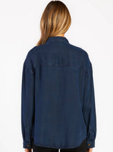 Load image into Gallery viewer, Meet your everyday layer—this utility style shirt is equally cozy and stylish. This long sleeve collar shirt is finished with tencel, button details, and front flap pockets.  100% Eco-Friendly Tencel Machine wash cold, tumble dry low Color: Overdye Indigo Model is 5&#39;9&quot; and wearing a size S.
