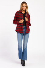 Load image into Gallery viewer, The Stanton Jacket is the perfect piece for your fall wardrobe. This plaid shacket features long sleeves, button front, and flap chest pockets. It&#39;s versatile enough to be worn as a standalone piece or layered over a shirt or sweater. The Stanton Jacket is sure to keep you warm and stylish all season long. 90% Poly and 10% Wool Machine wash cold, tumble dry low Color: Red Black Plaid Model is 5&#39;9&quot; and wearing a size S.
