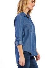 Load image into Gallery viewer, The Riley collared button down shirt features rolled tab sleeves, double chest pockets, a split back tail, and a frayed hem. This shirt is a perfect staple to any wardrobe.   100% Eco Friendly Tencel™ Machine wash cold Color: Calva Model is 5&#39;9&quot; and wearing a size S
